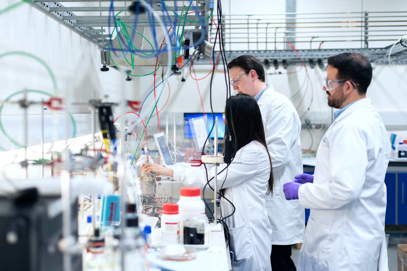 Researchers working at a laboratory bench