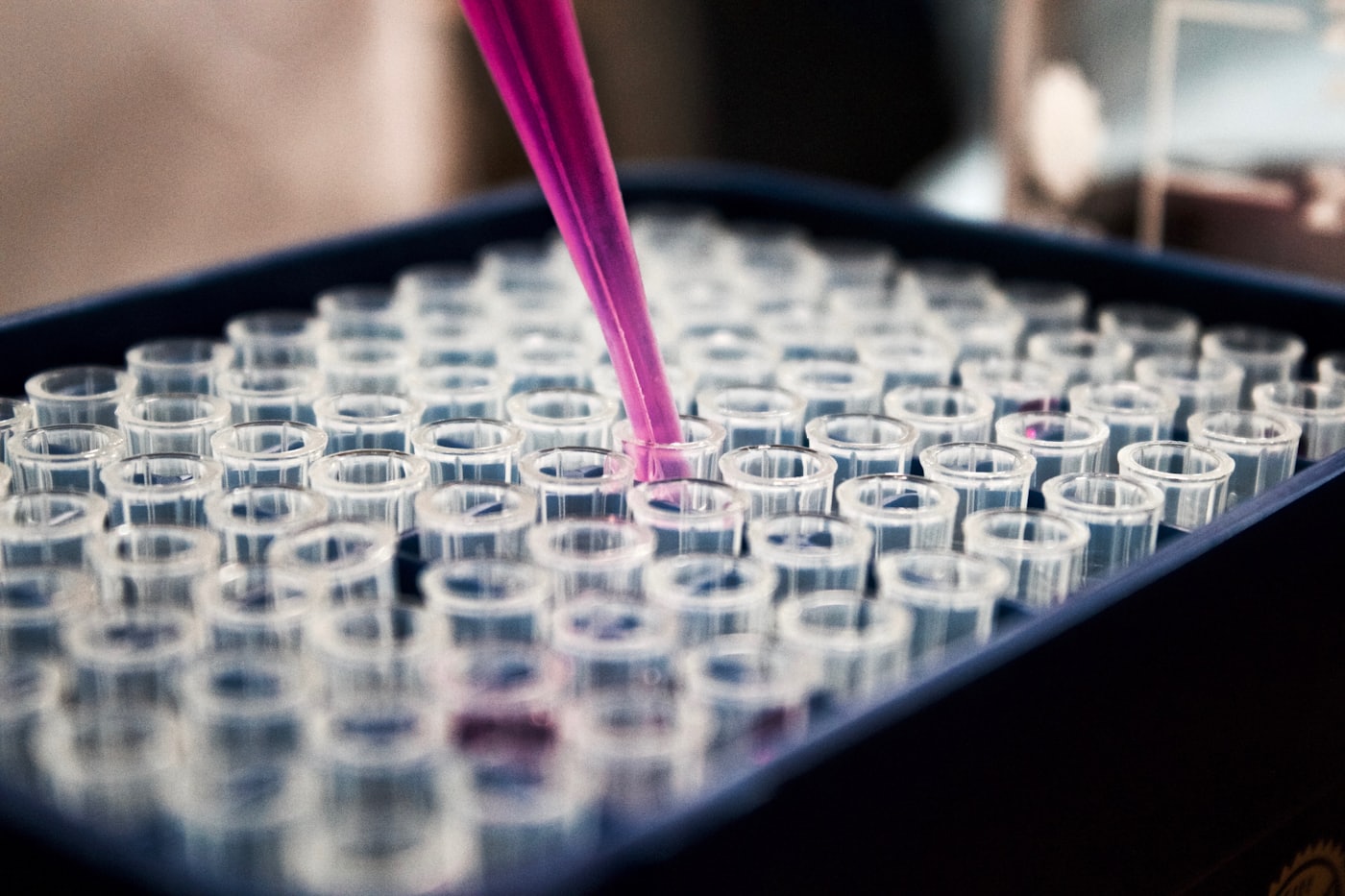 Pipette above an array of sample tubes